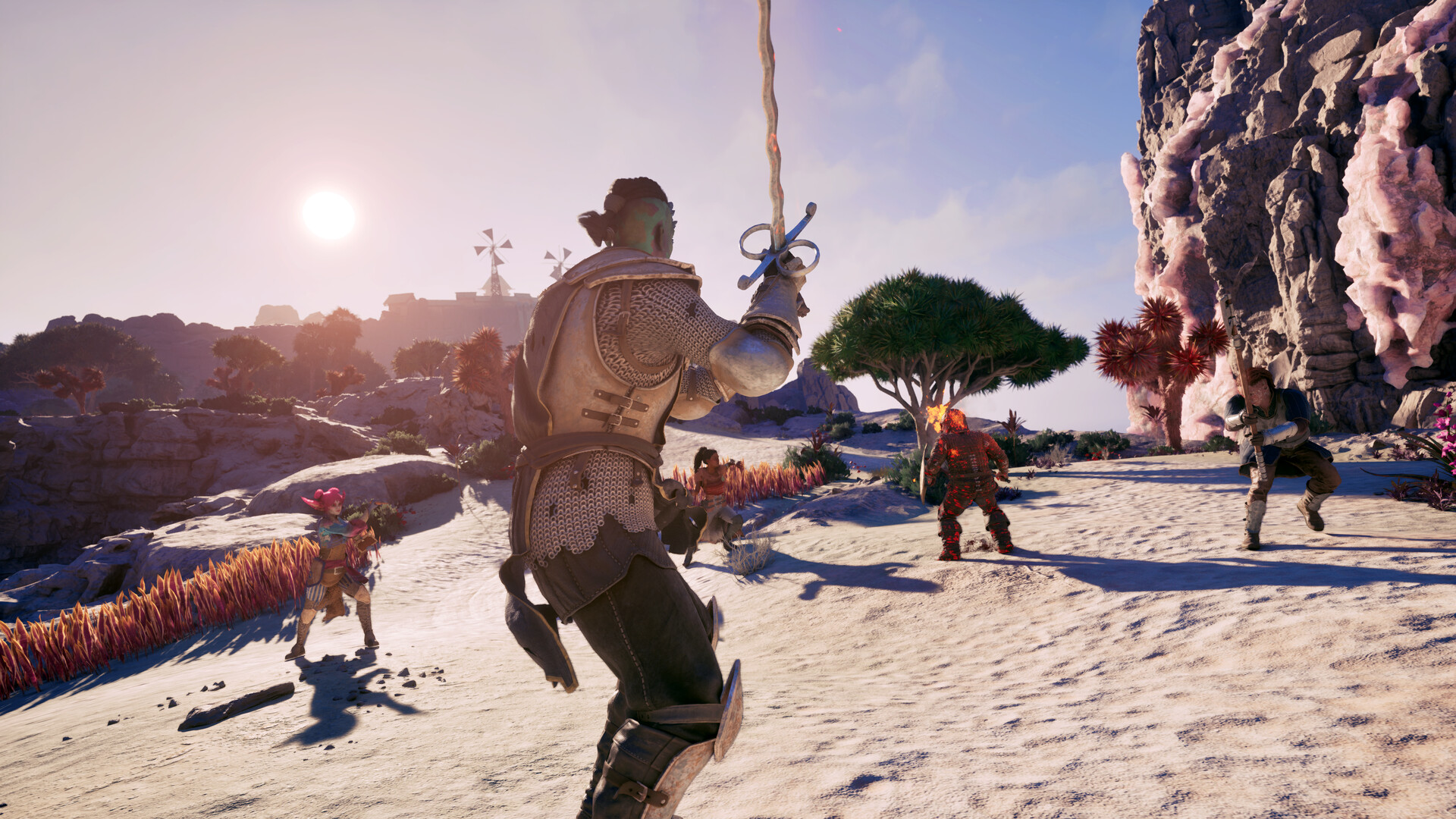 Avowed - Personaje avanzando con espada hacia varios enemigos en un paraje desertico - Juegosrpg.com