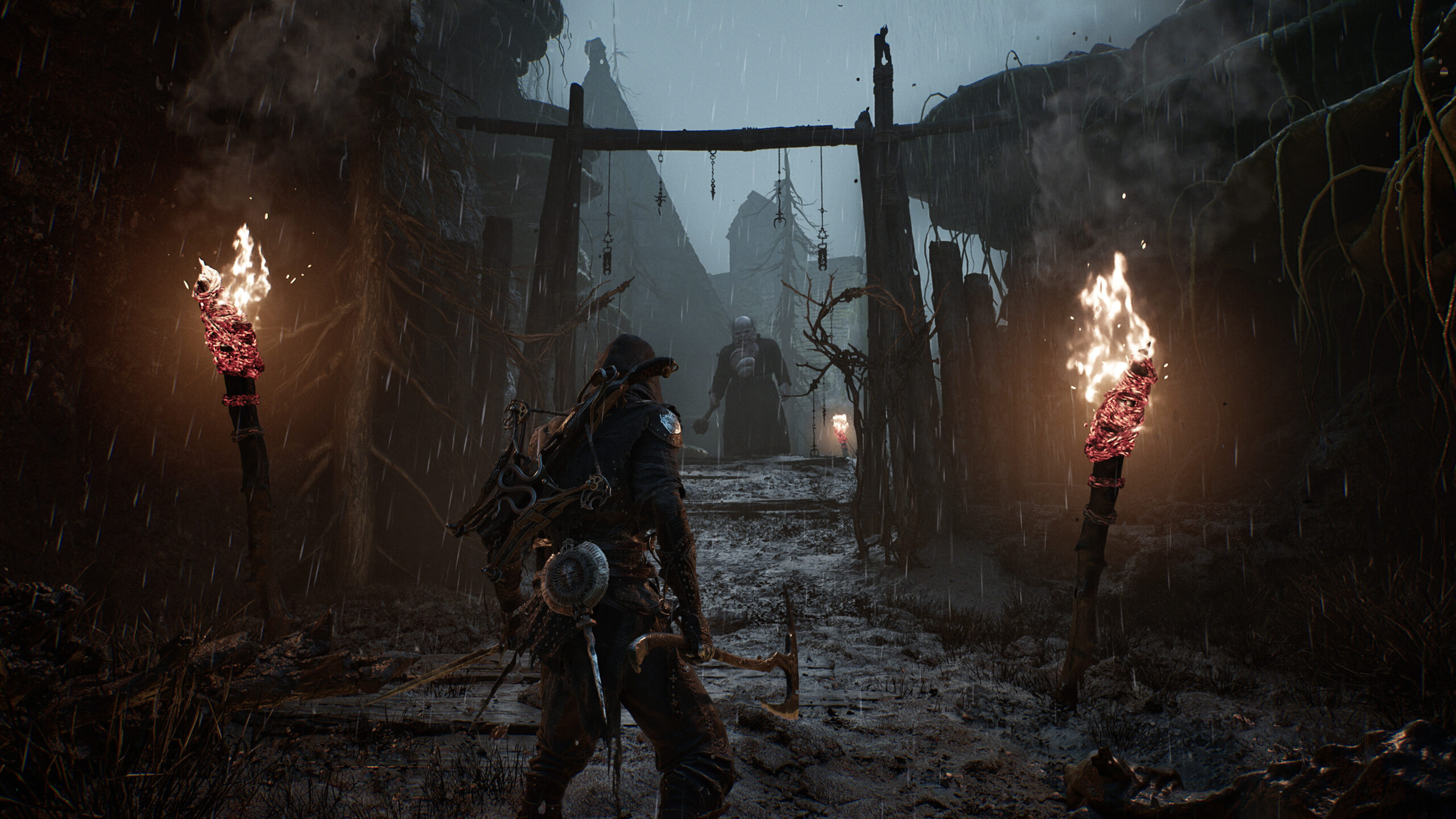 Mortal Shell II - entrada a una aldea en ruinas bajo la lluvia - Juegosrpg.com