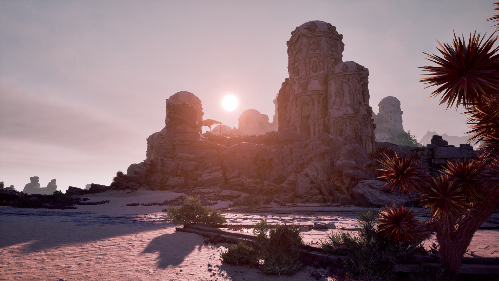 Avowed - atardecer sobre unas ruinas de piedra tallada en un paisaje desértico - Juegosrpg.com