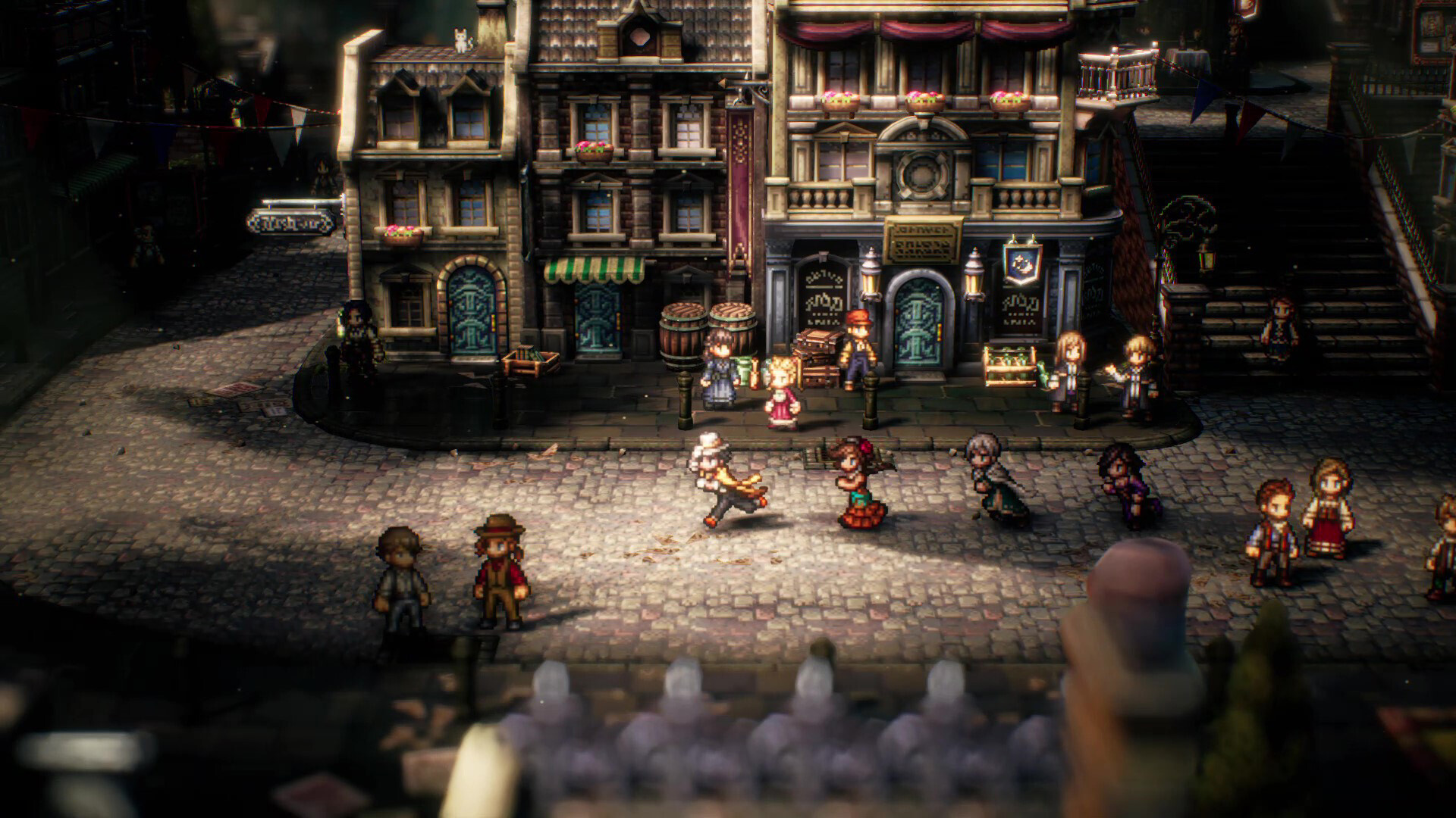 Octopath Traveler II - combate por turnos en una plaza con edificios en estilo HD-2D - Juegosrpg.com